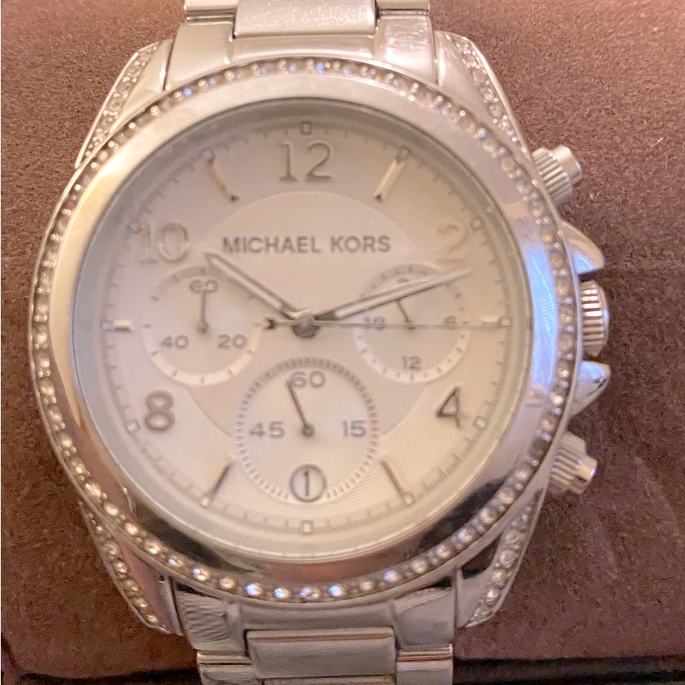 Authentic Michael Kors silver watch- original box, watch case, and care booklet.